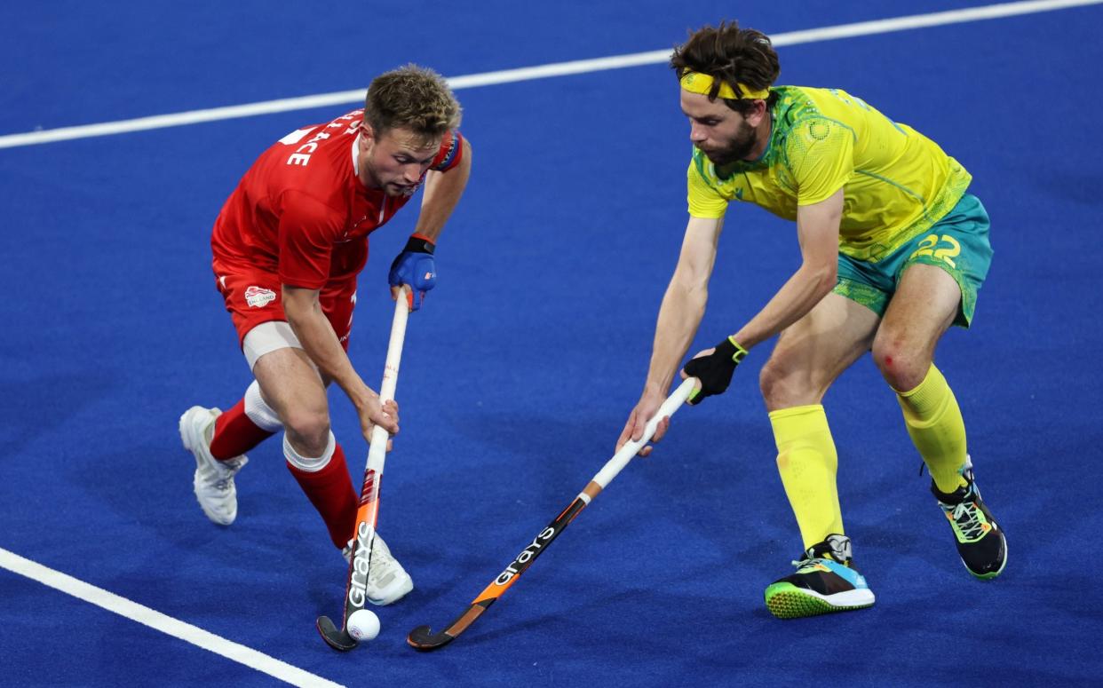 Zachary Wallace of Team England competes with Flynn Ogilvie of Team Australia during the Men's Hockey - Semi-Final match between Australia and England - Clive Brunskill