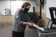 Robert Rodriguez cast his primary ballot at the Minnesota Army National Guard N.E. Minneapolis Training and Community Center Tuesday, Aug. 11, 2020 in Minneapolis. (Anthony Souffle/Star Tribune via AP)