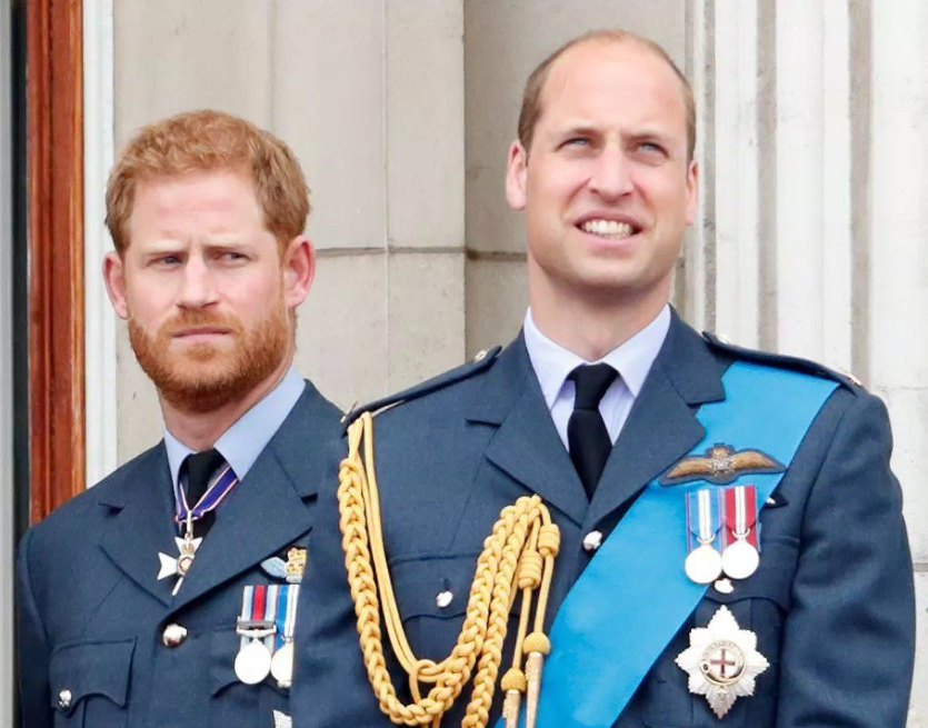 Prince Harry, Duke of Sussex and Prince William, Duke of Cambridge watch a flypast to mark the centenary of the Royal Air Force from the balcony of Buckingham Palace on July 10, 2018 in London, England. 