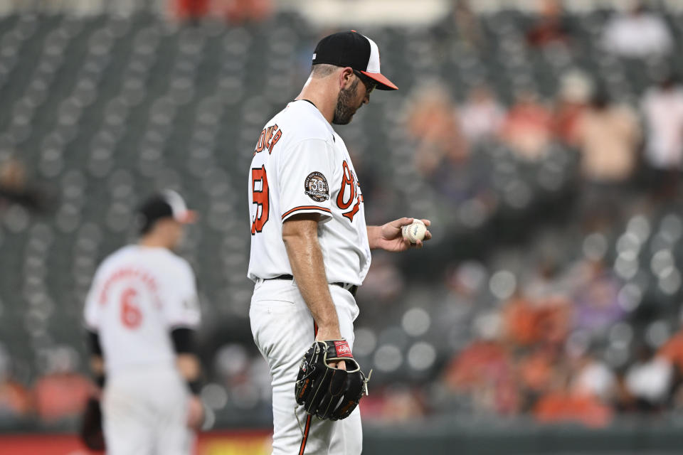 Baltimore Orioles pitcher Zac Lowther pauses on the mound after the Seattle Mariners score four runs in the third inning of a baseball game Tuesday, May 31, 2022, in Baltimore. (AP Photo/Gail Burton)