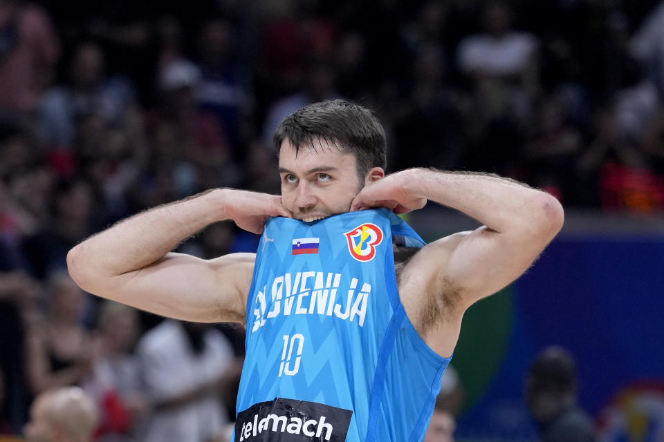 Slovenia's Mike Tobey reacts after losing to Canada in a Basketball World Cup quarterfinal game in Manila, Philippines, Wednesday, Sept. 6, 2023. (AP Photo/Michael Conroy)