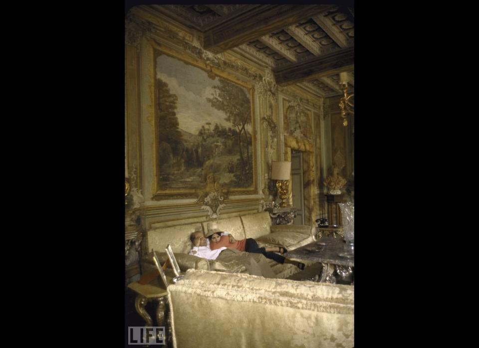 Loren's film producer husband Carlo Ponti had promised her "the most beautiful house in the world" when they married in 1957. Here the couple lounges in their lavishly outfitted living room with stunningly beautiful frescoes.