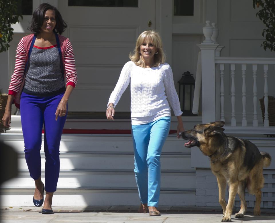 Michelle Obama, Jill Biden and Champ arrive to help assemble Mother's Day packages that deployed U.S. troops requested to be sent to their mothers and wives at home at the Naval Observatory in May 2012. (Photo: SAUL LOEB via Getty Images)