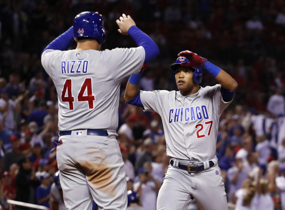 Cubs shortstop Addison Russell is congratulated by teammate Anthony Rizzo after hitting a three-run home run in the Cubs division-clinching win. (AP)