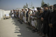 Relatives pray for one of three women working for a local radio and TV station who were killed on Tuesday in attacks claimed by the Islamic State group, during her funeral ceremony in Jalalabad, east of Kabul, Afghanistan, Wednesday, March 3, 2021. The coordinated killings were the latest in a bloody campaign against journalists where in just the last six months, 15 journalists have been killed in a series of targeted killings. (AP Photo)