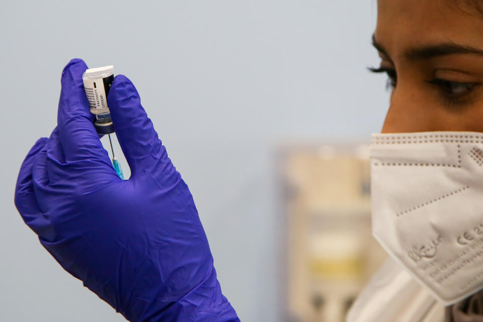 LONDON, UNITED KINGDOM - 2021/04/14: A NHS staff member prepares to administer the Pfizer and BioNTech vaccine. (Photo by Dinendra Haria/SOPA Images/LightRocket via Getty Images)