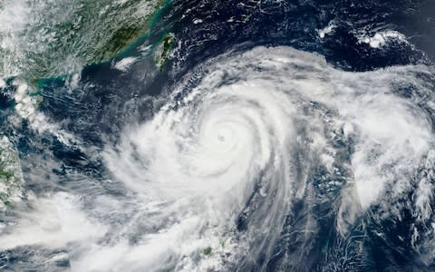Satellite photos show the size of Super Typhoon Mangkhut as it barrels through the northern Philippines - Credit: Jonathan Mitchell/Alamy Live News