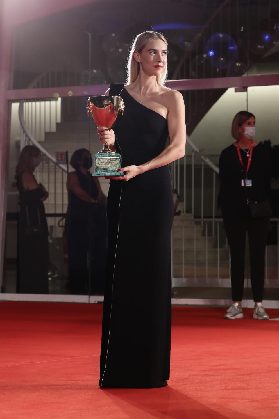 Vanessa Kirby poses with the Coppa Volpi prize for best actress in "Pieces of a Woman" at the Venice Film Festival.