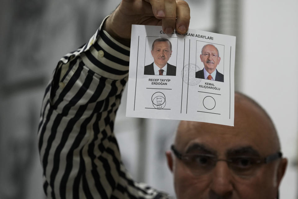 An election representative shows a ballot with a vote for the Turkish President and leader of the People's Alliance party Recep Tayyip Erdogan, at a polling station in Istanbul, Turkey, Sunday, May 28, 2023. Turkish President Recep Tayyip Erdogan has dissipated a challenge by an opponent who sought to reverse his increasingly authoritarian leanings, securing five more years to oversee the country at the crossroads of Europe and Asia that plays a key role in NATO. (AP Photo/Emrah Gurel)