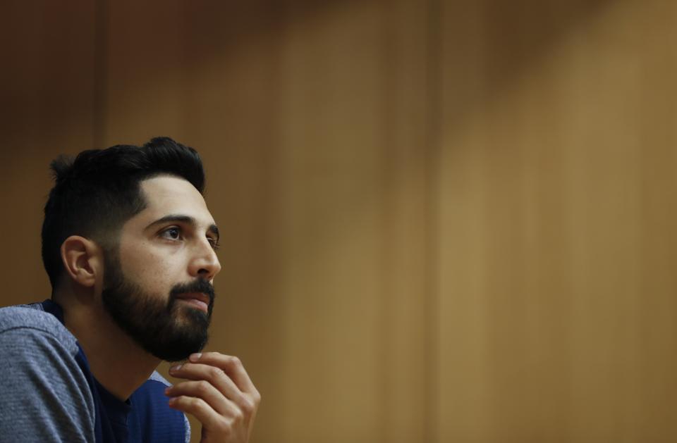 Milwaukee Brewers starting pitcher Gio Gonzalez answers questions at a news conference for Game 1 of the National League Championship Series baseball game against the Los Angeles Dodgers Thursday, Oct. 11, 2018, in Milwaukee. (AP Photo/Jeff Roberson)