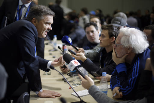 International Ice Hockey Federation President Rene Fasel, left, answer questions at a news conference at the 2014 Winter Olympics, Tuesday, Feb. 18, 2014, in Sochi, Russia. (AP Photo/Mark Humphrey)