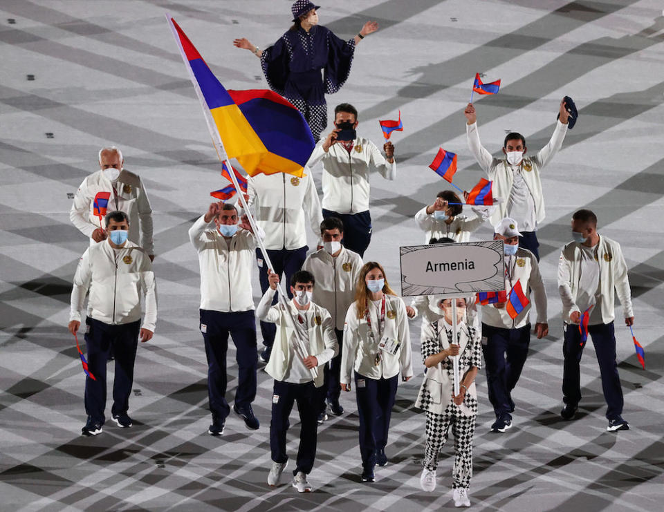 Armenia's athletes wore track suits with light colored jackets and dark pants