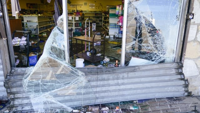 The aftermath of ransacked liquor store in Philadelphia is shown.