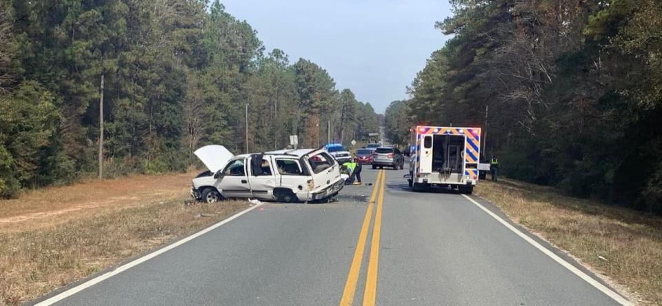 A white Chevy Tahoe blocks traffic on County Road 393, south of the Shoal River Bridge in Crestview following a rollover crash on Friday morning. The driver was flown to an area hospital to be treated for critical injuries.