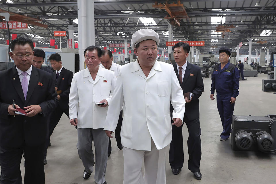 This photo provided on Thursday, Aug. 24, 2023, by the North Korean government shows North Korean leader Kim Jong Un, center, during his visit to a tractor factory in Nampo city, North Korea on Aug. 23, 2023. Independent journalists were not given access to cover the event depicted in this image distributed by the North Korean government. The content of this image is as provided and cannot be independently verified. (Korean Central News Agency/Korea News Service via AP)