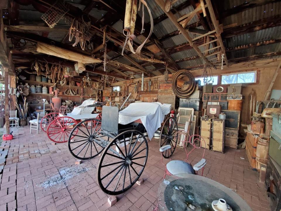 Antique horse carts in the garage.