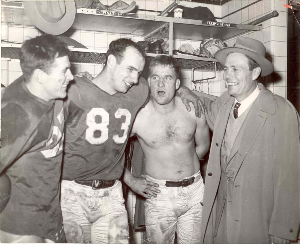 1953 Detroit Lions championship locker room scene:
Left to right in Briggs Stadium following the championship victory are Doak Walker, Jim Doran, Bobby Layne and head coach Buddy Parker. The Lions were down 16-10 in the closing minutes and Layne marched the offense 80 yards to victory when he hit Doran for a 33-yard touchdown pass.