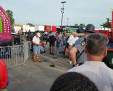 <p>A person is attended to as authorities respond after the Fire Ball amusement ride malfunctioned injuring several at the Ohio State Fair, Wednesday, July 26, 2017, in Columbus, Ohio. Columbus Fire Battalion Chief Steve Martin said that some of the victims were thrown from the ride when it malfunctioned Wednesday night. (Justin Eckard via AP) </p>
