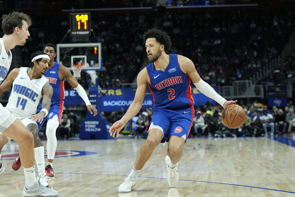 Detroit Pistons guard Cade Cunningham (2) brings the ball up court during the first half of an NBA basketball game against the Orlando Magic, Sunday, Feb. 4, 2024, in Detroit. (AP Photo/Carlos Osorio)