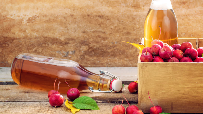 Cider bottle with apples