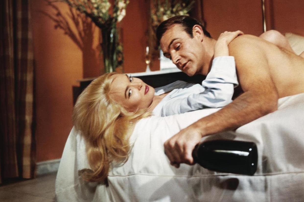 Irresistible: James Bond (Sean Connery) beds Jill Masterson (Shirley Eaton) in Goldfinger, 1964: Sportsphoto Ltd./Allstar