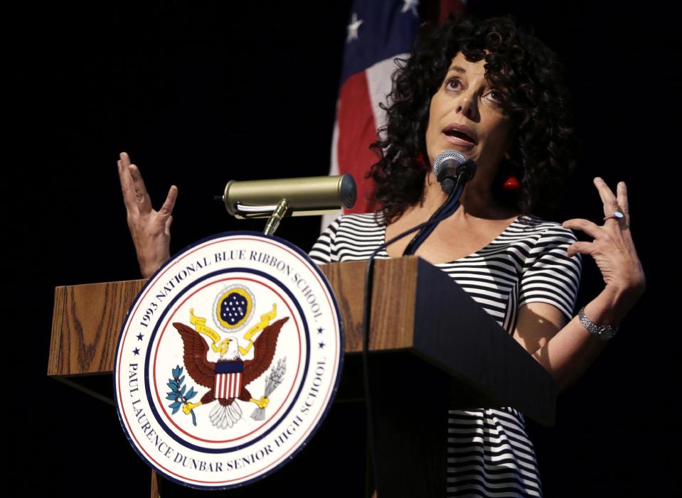 Susan Pimentel, an educational consultant and curriculum specialist and Vice Chair of the National Assessment Governing Board gestures as she speaks during a program at Dunbar High School, Wednesday, May 7, 2014, in Washington, to announce results of The Nation's Report Card: 2013 Mathematics and Reading, Grade 12, which details 12th graders' performance in mathematics and reading nationwide and in 13 pilot states. In an abysmal showing, only about one-quarter of U.S. high school seniors performed solidly in math in a major assessment known as the nation's report card, reinforcing concerns that large numbers of students are unprepared for either college or the workplace. (AP Photo/Carolyn Kaster)