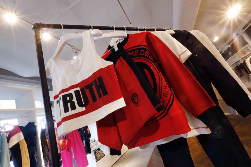 In this Feb. 20, 2020, photo, items from H&M’s new street wear collection are displayed at a store in New York. The collection was designed in collaboration with Ruth Carter, the Academy-Award winning designer behind the costumes for films such as “Black Panther” and “Malcolm X." It debuted as more companies and brands are getting into the business of Black History Month but also trying not to leave the impression that African American consumers are important just once a year. (AP Photo/Richard Drew)