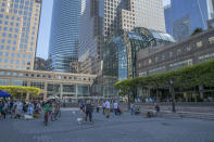 <p>People walk through the courtyard just outside of Brookfield Place (originally known as the World Financial Center) in lower Manhattan on Aug. 13, 2017. (Photo: Gordon Donovan/Yahoo News) </p>