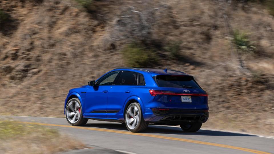 2024 audi sq8 etron suv in blue on winding road