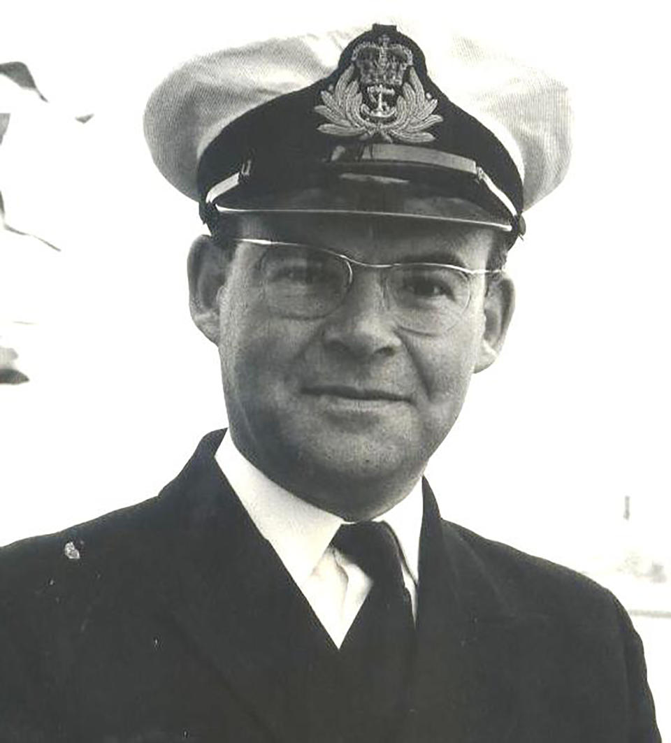 In this image taken June 29, 1977, Lt. Cmdr. Robert Embleton, during Queen Elizabeth II's review of the fleet at Portsmouth, southern England for her Silver Jubilee. From resounding applause to ostracization and isolation. That's essentially the journey Lt. Cmdr. Robert Embleton, who served 34 years in Britain's Royal Navy, took by ambulance when discharged from Derriford Hospital in Plymouth, southwest England, on April 8 following his near-month sickness with the coronavirus. (Courtesy of Robert Embleton via AP)