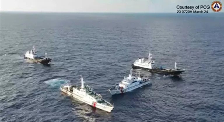 Aerial video footage shows a China Coast Guard ship (2nd L) and vessels identified by the Philippine Coast Guard as 'Chinese maritime militia' (L and R) surrounding the Philippine ship BRP Cabra (Handout)