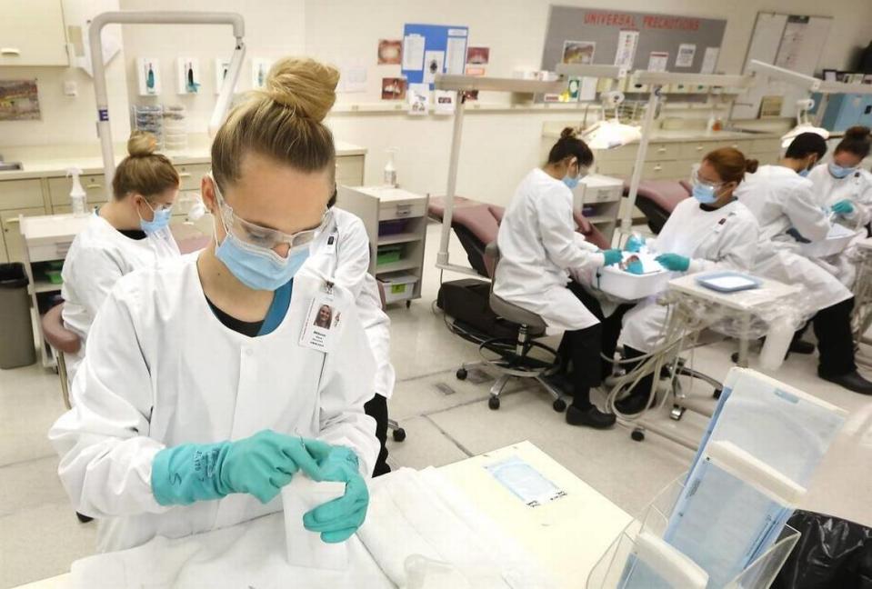 A student prepares dental instruments for sterilizing during a dental assistant class at Tri-Tech Skill Center in Kennewick.