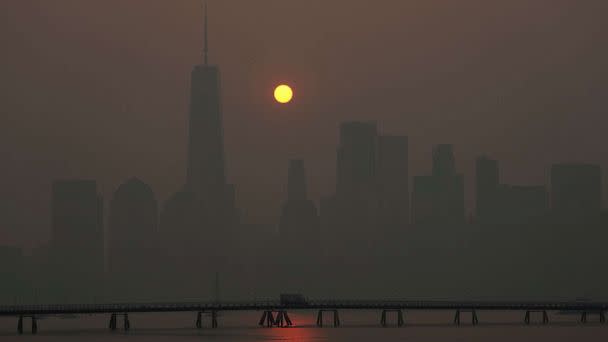 PHOTO: The sun rises over the lower Manhattan skyline as seen from Jersey City, N.J., June 8, 2023. (Seth Wenig/AP)