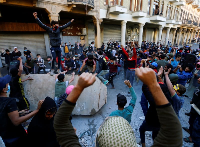 Iraqi demonstrators take part in ongoing anti-government protests in Baghdad