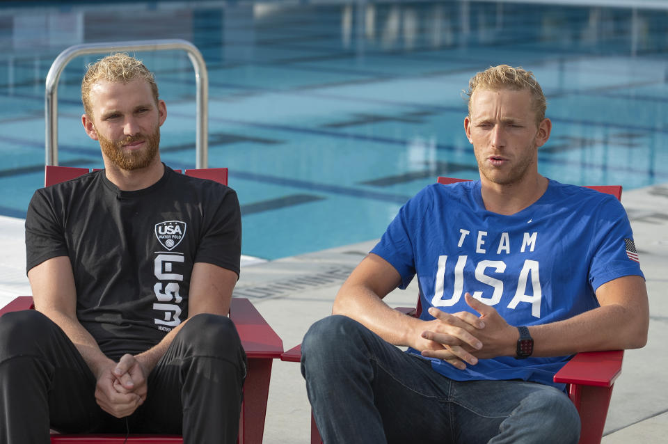 U.S. Men's Water Polo players, attacker Quinn Woodhead, left, and defender Dylan Woodhead, are interviewed after a training session, Wednesday, Jan. 17, 2024, in Mt. San Antonio College in Walnut, Calif. The U.S. water polo teams for the Olympics could have a much deeper connection than just a mutual love of their grueling sport. Chase and Ryder Dodd are trying to make the men's roster, alongside another pair of brothers in Dylan and Quinn Woodhead. Ella Woodhead, Dylan and Quinn's sister, is in the mix for the loaded women's squad. The Woodheads are from Northern California, and the Dodds grew up in Southern California. There are a couple more siblings in different sports who also could be competing in Paris this summer. (AP Photo/Damian Dovarganes)