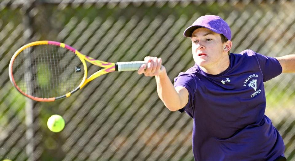 Martha's Vineyard number one singles player Zak Potter reaches for a forehand against Barnstable on Friday, May 5, 2023.