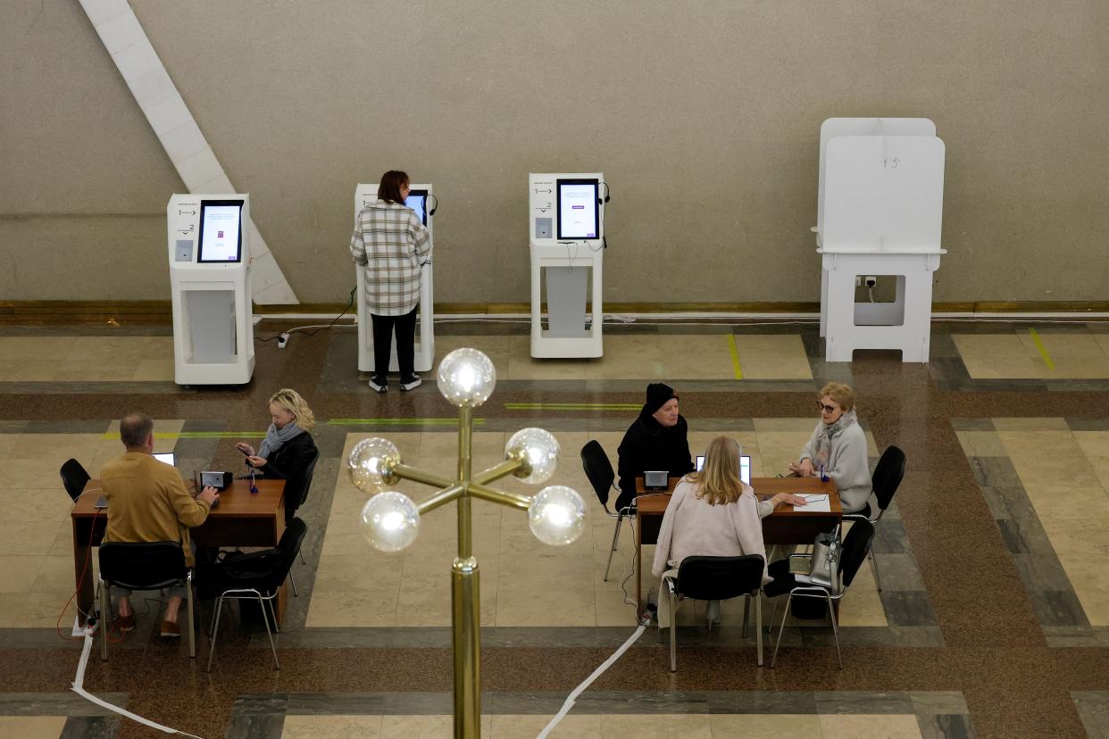 People visit a polling station during the city mayoral elections in Moscow (REUTERS)