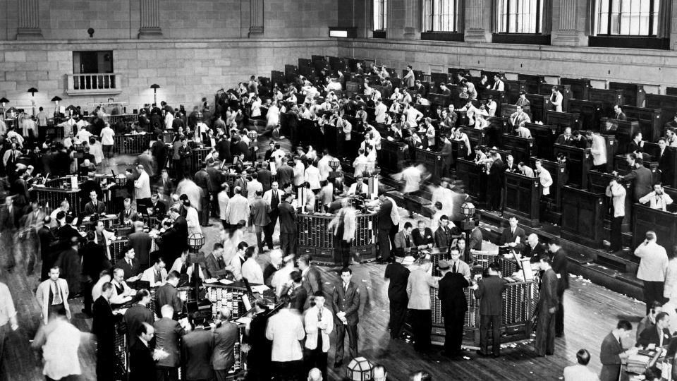 Traders rush as the New York Stock Exchange crashed in October 1929, sparking a run on banks that spread across the country. - AFP/Getty Images