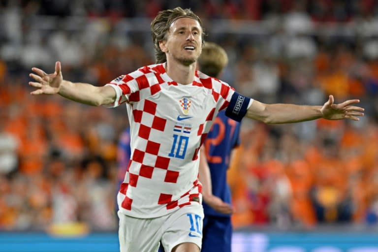 <a class="link " href="https://sports.yahoo.com/soccer/teams/croatia/" data-i13n="sec:content-canvas;subsec:anchor_text;elm:context_link" data-ylk="slk:Croatia;sec:content-canvas;subsec:anchor_text;elm:context_link;itc:0">Croatia</a> midfielder <a class="link " href="https://sports.yahoo.com/soccer/players/373154" data-i13n="sec:content-canvas;subsec:anchor_text;elm:context_link" data-ylk="slk:Luka Modric;sec:content-canvas;subsec:anchor_text;elm:context_link;itc:0">Luka Modric</a> celebrates after scoring his team's fourth goal from the penalty spot against the <a class="link " href="https://sports.yahoo.com/soccer/teams/netherlands/" data-i13n="sec:content-canvas;subsec:anchor_text;elm:context_link" data-ylk="slk:Netherlands;sec:content-canvas;subsec:anchor_text;elm:context_link;itc:0">Netherlands</a> (JOHN THYS)