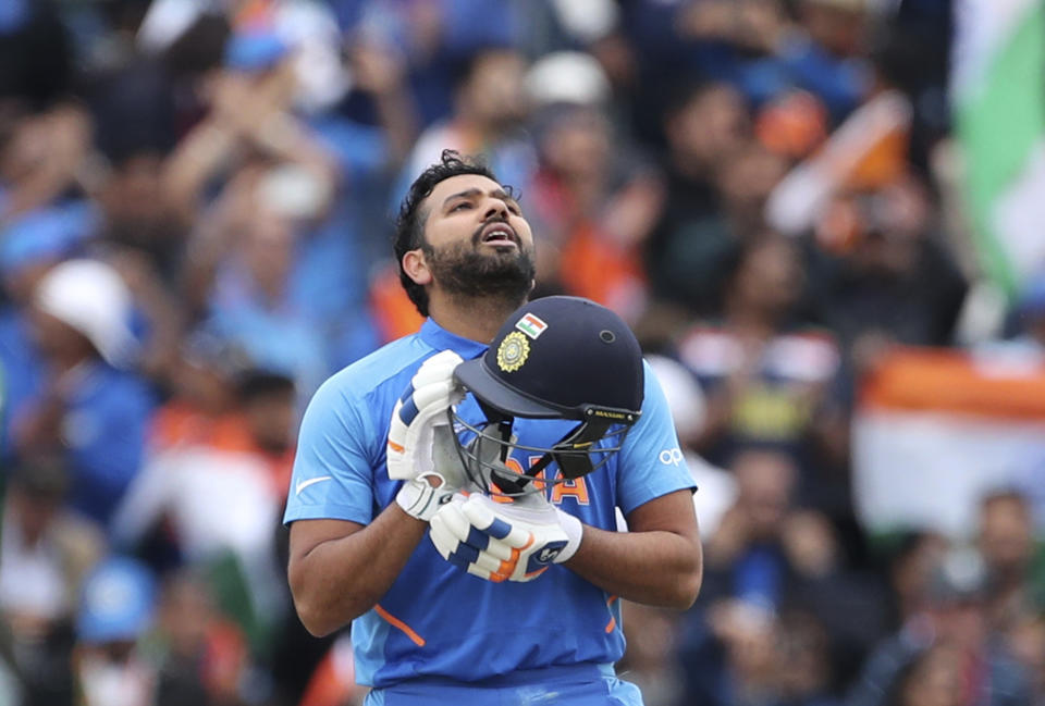 India's Rohit Sharma looks skywards to celebrate scoring a century during the Cricket World Cup match between India and Pakistan at Old Trafford in Manchester, England, Sunday, June 16, 2019. (AP Photo/Aijaz Rahi)