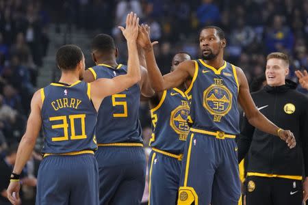 January 11, 2019; Oakland, CA, USA; Golden State Warriors forward Kevin Durant (35) celebrates with guard Stephen Curry (30) during the first quarter against the Chicago Bulls at Oracle Arena. Mandatory Credit: Kyle Terada-USA TODAY Sports