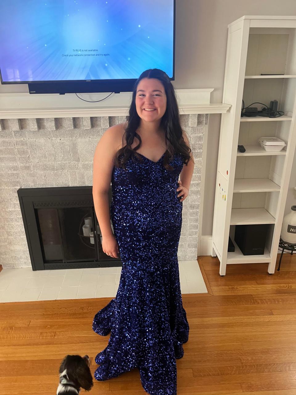Dakota Costa, a senior at Taunton High School, wears a prom dress that was rescued from a fire that destroyed her family's home.