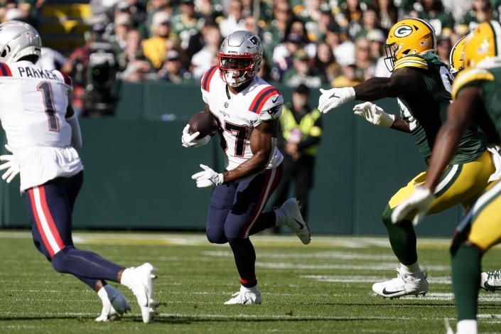 New England Patriots running back Damien Harris (37) carries the ball up field during the first half of an NFL football game against the Green Bay Packers, Sunday, Oct. 2, 2022, in Green Bay, Wis. (AP Photo/Morry Gash)