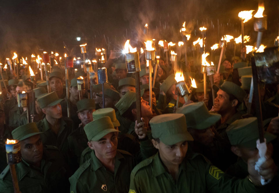 Thousands take part in the March of the Torches in remembrance of national independence hero Jose Marti's 166th birthday, and also pay tribute to the late revolutionary leader Fidel Castro, in Havana, Cuba, Monday, Jan. 28, 2019. (AP Photo/Ramon Espinosa)