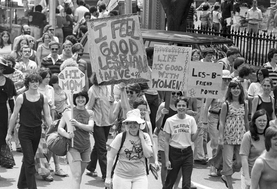 View of the large crowd, some of whom are holding up handmade signs and banners, participating in a gay and lesbian Pride parade in the Back Bay neighborhood of Boston, 1970. (Photo by Spencer Grant/Getty Images)