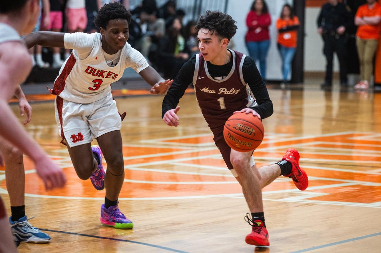 New Paltz's Cayden Dones, right, drives down court during the Section 9 boys basketball game on Feb. 2, 2024.