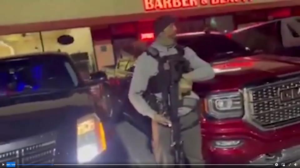 While working security for JD's Pub, police say Jordan Morris violated a protective order prohibiting him from firearms. He allegedly stands outside the unlicensed bar in this screenshot from a video published by IMPD in April 2022.