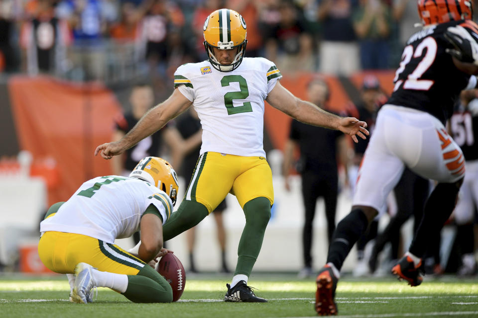 Green Bay Packers kicker Mason Crosby (2) kicks the winning field goal in overtime for a final score of 25-22 during an NFL football game against the Cincinnati Bengals, Sunday, Oct. 10, 2021, in Cincinnati. (AP Photo/Emilee Chinn)