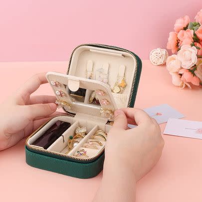 This compact velvet jewellery box doubles as a travel essential