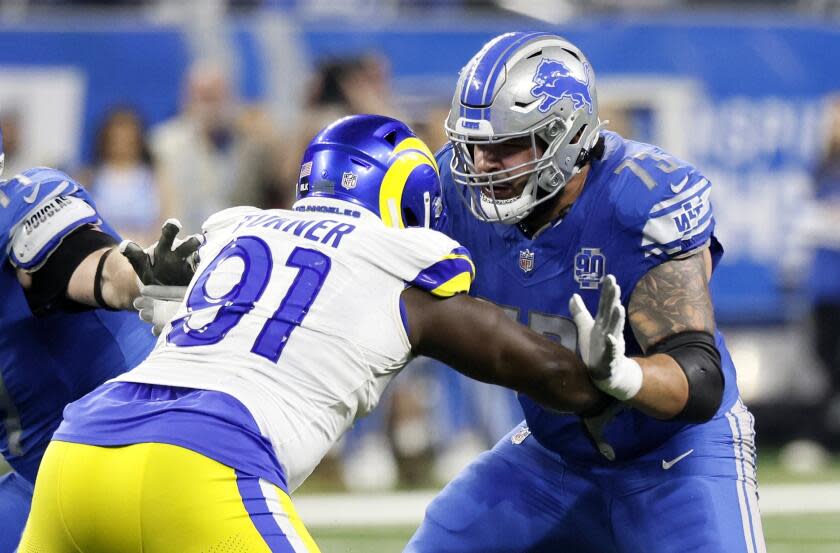 Detroit Lions guard Jonah Jackson (73) blocks against Rams defensive tackle Kobie Turner (91) in the playoffs.